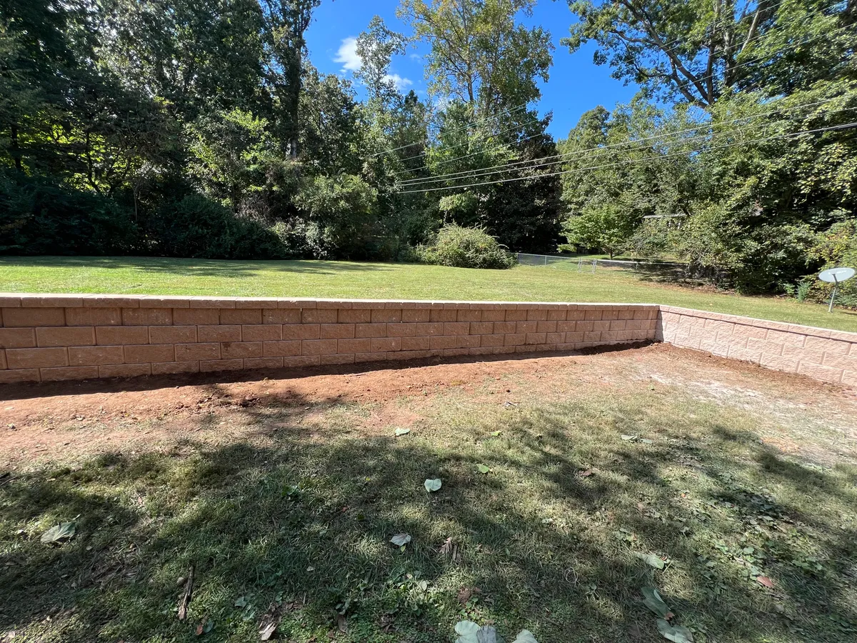 Long retaining wall grass yard