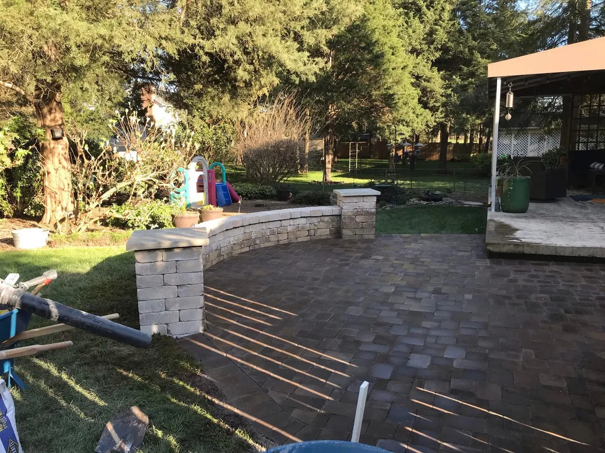 Paver patio with stone seating wall